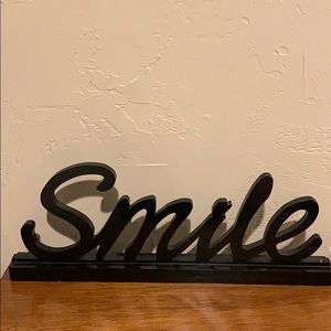 Smile word sign